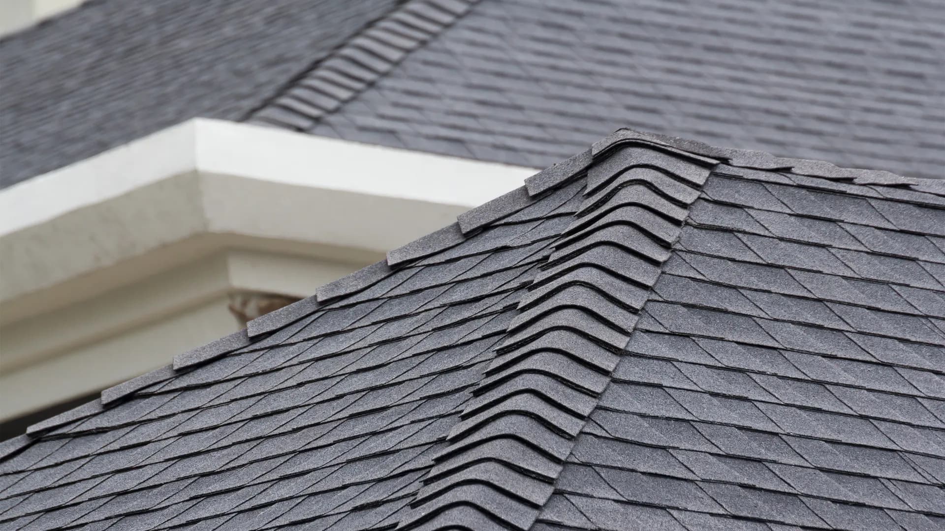 Close detail of shingle ridge installation on a Lindon, UT home
